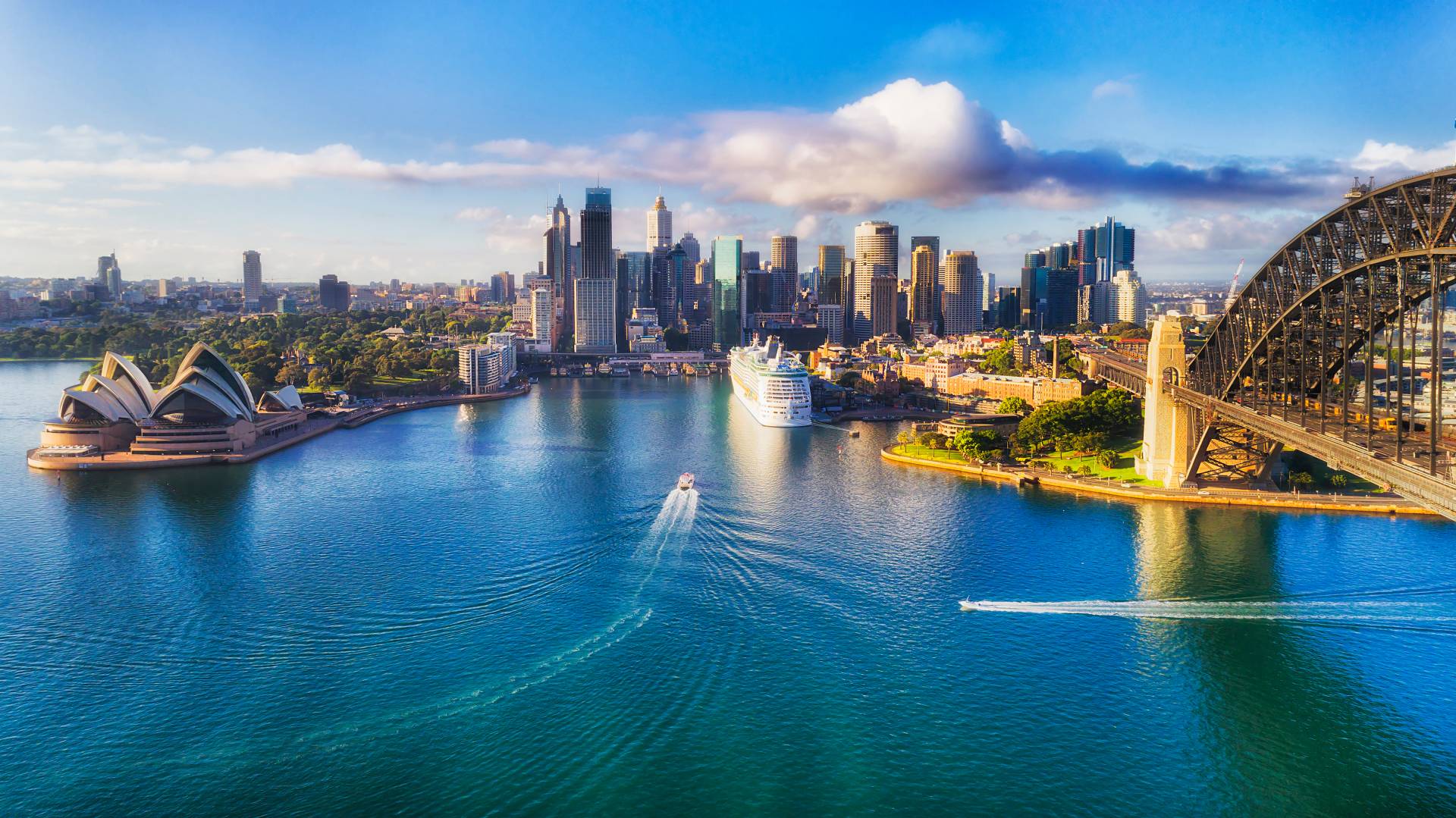 Iconic Sydney Opera House with the harbor in the foreground, highlighting the cultural landmarks near luxury listings.